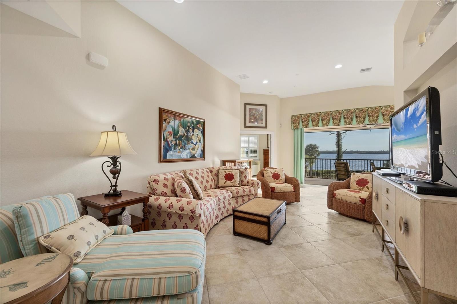Living Room - View of screened porch/vaulted ceilings