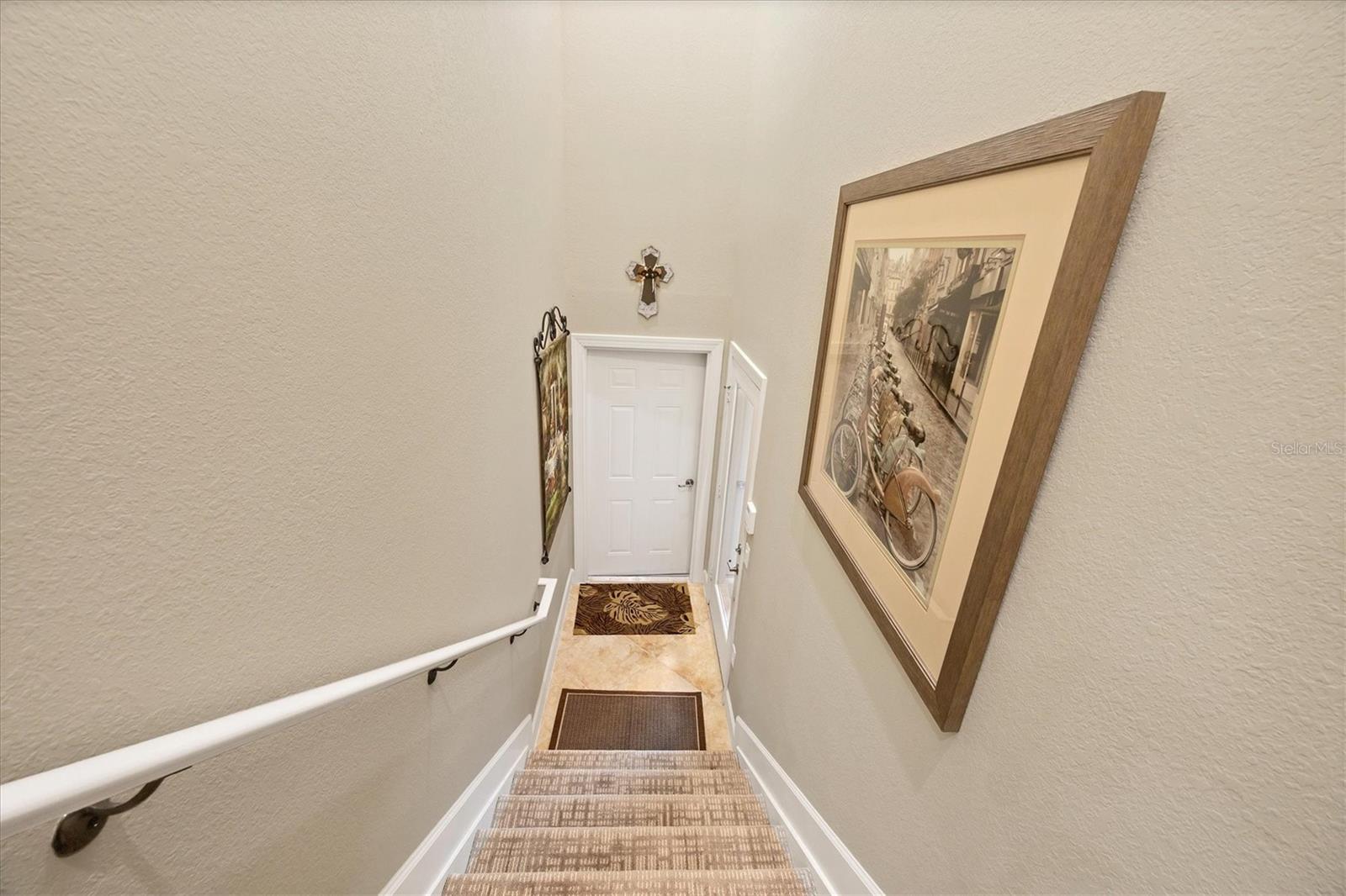 Stairs to enter - new carpet. Door to garage. Stairs to enter - new carpet. Door to garage.