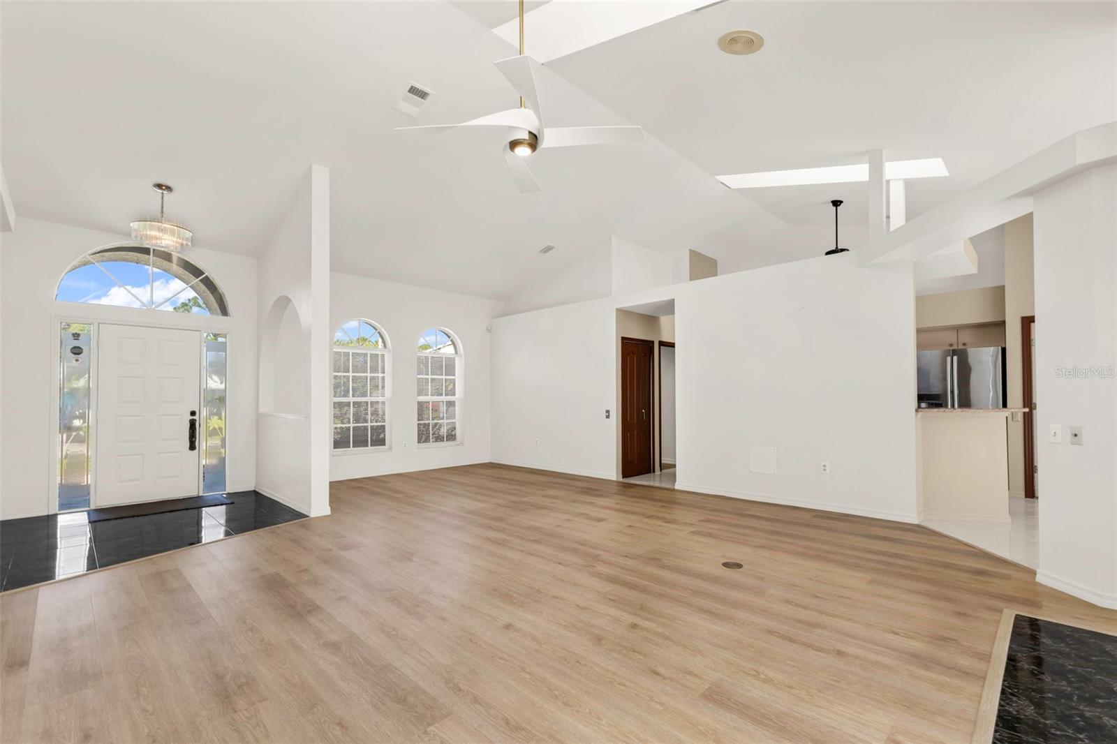 Living room looking at foyer and formal dinning or flex space Living room looking at foyer and formal dinning or flex space