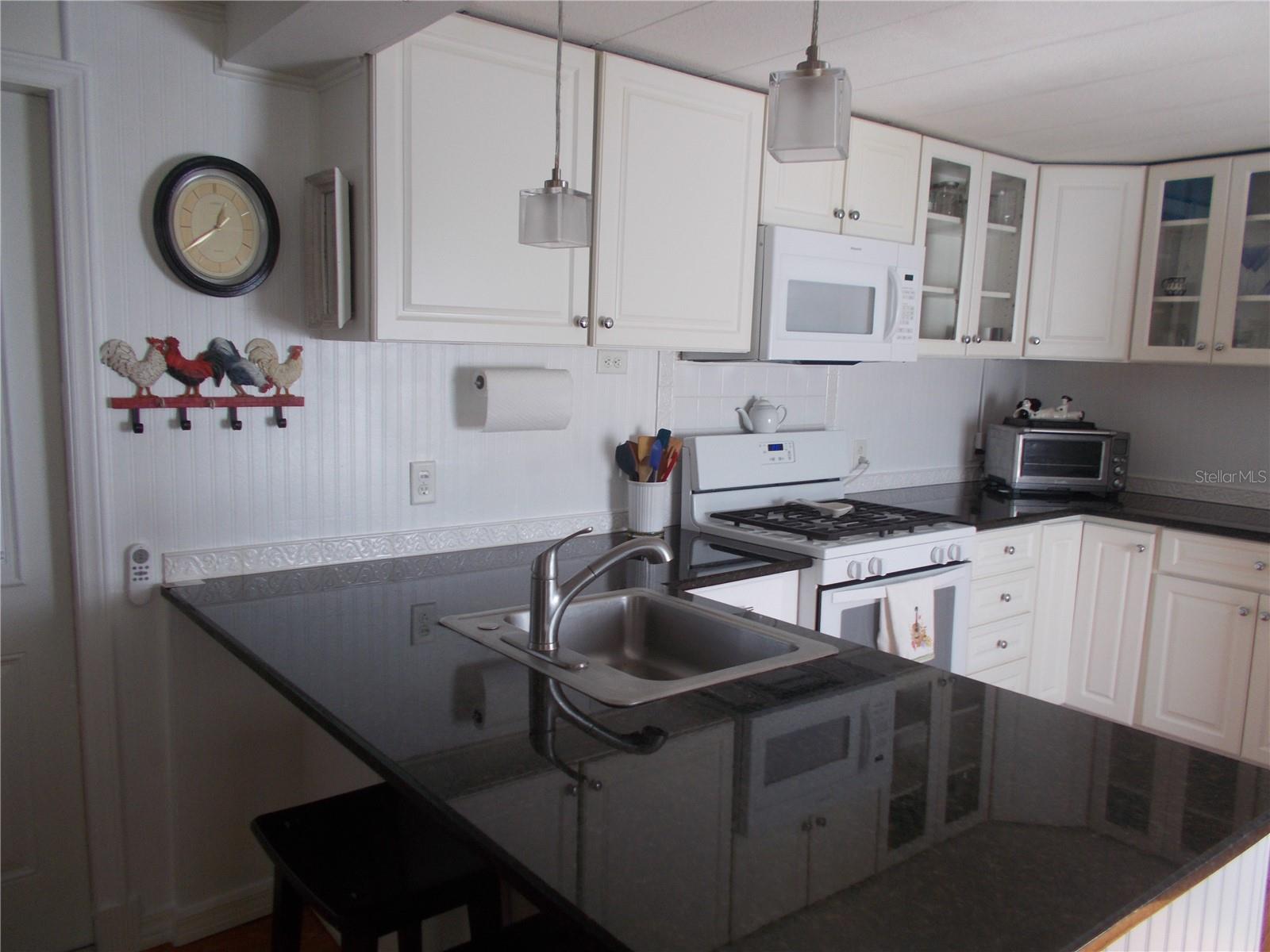 Kitchen showing granite countertop Kitchen showing granite countertop