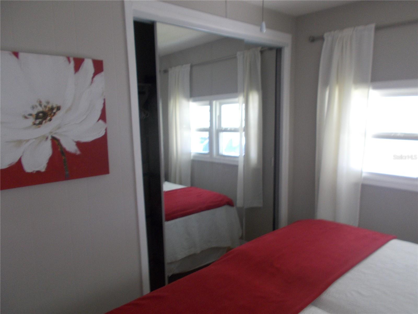 Bedroom #2 with mirrored closet