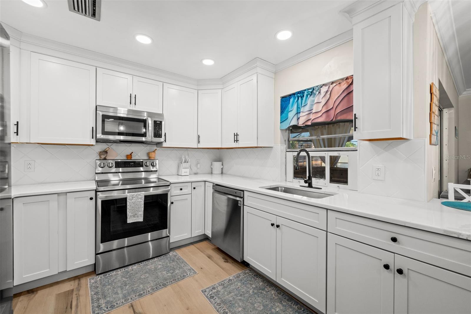 The kitchen is the heart  of the home. This bright and cheerful kitchen is no exception.
