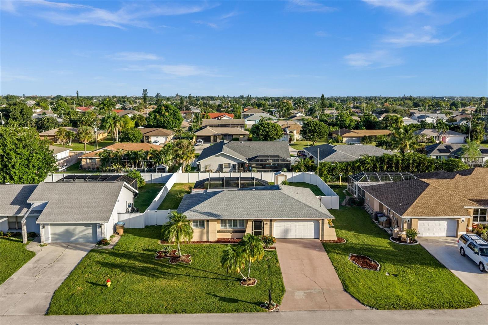This single family home features a new(er) 3-nail shingled roof, a concrete driveway, an attached two-car garage, a fenced backyard, and of course additional outdoor living space.