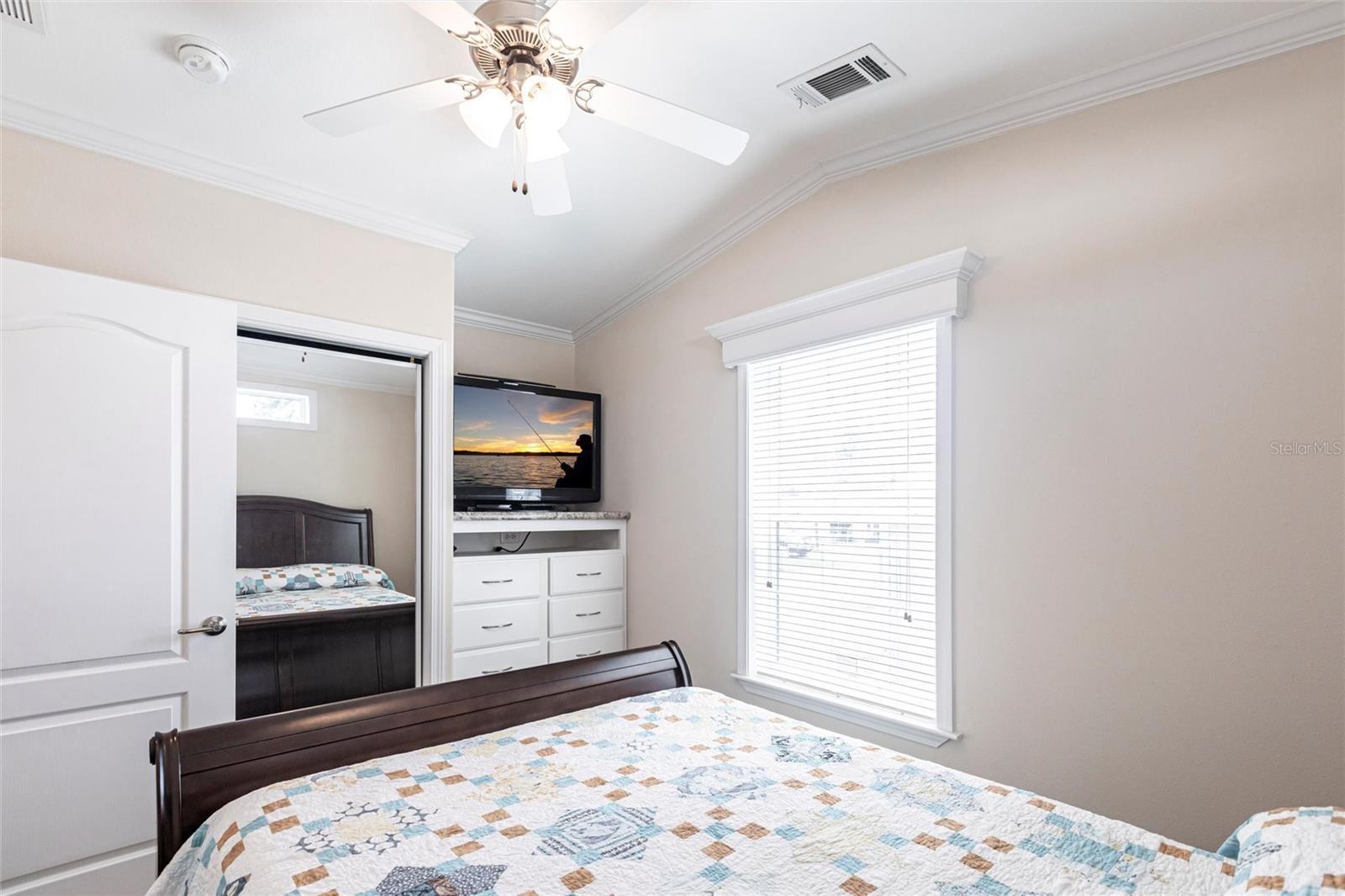 Bedroom built in dresser and sliding closet doors