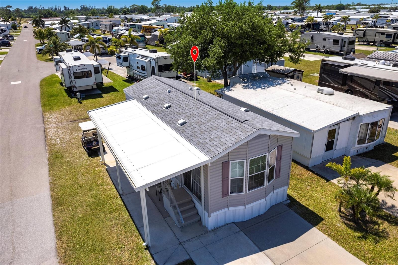 Aerial view of home and new shingle roof