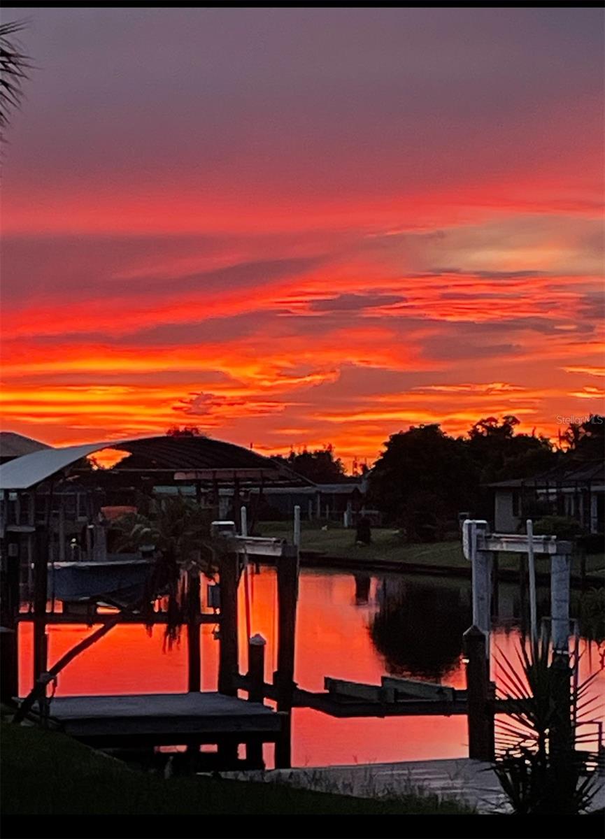 Enjoy beautiful water views and gorgeous sunsets from this desirable corner lot!