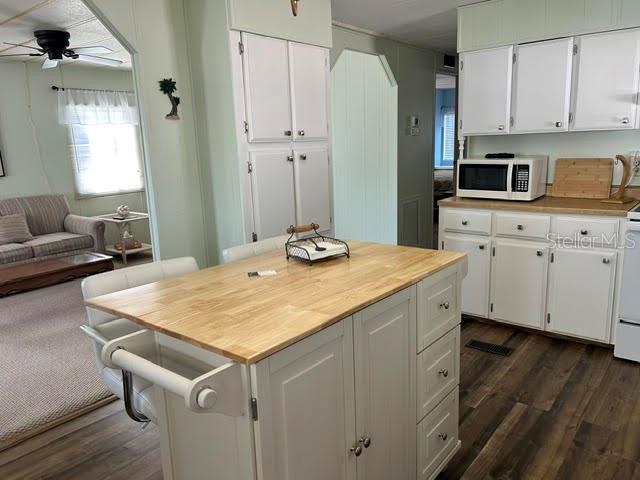 Kitchen with vinyl floors and island