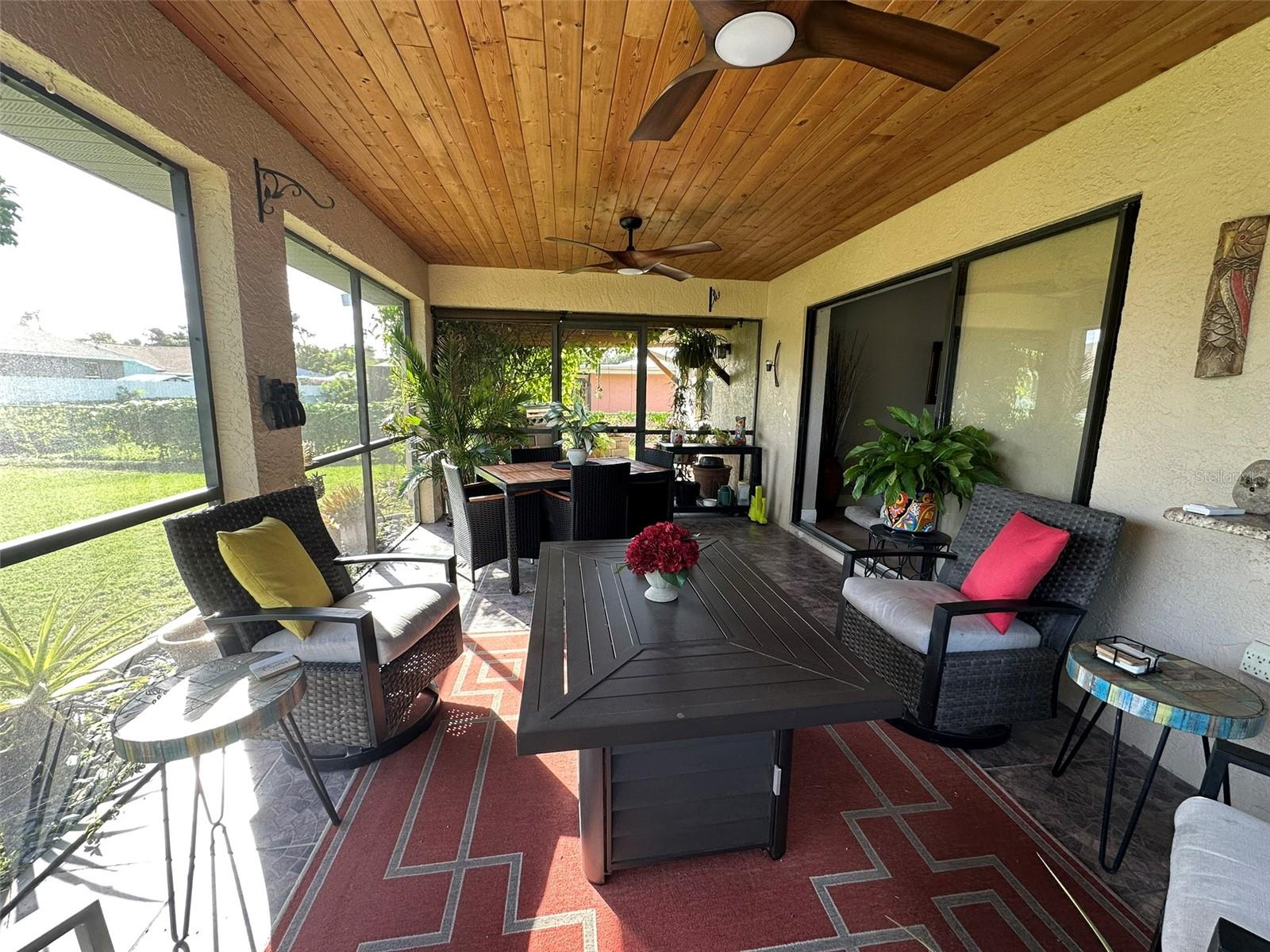 Lanai and pergola beyond it. The sliders to the dining room pock outside the house.