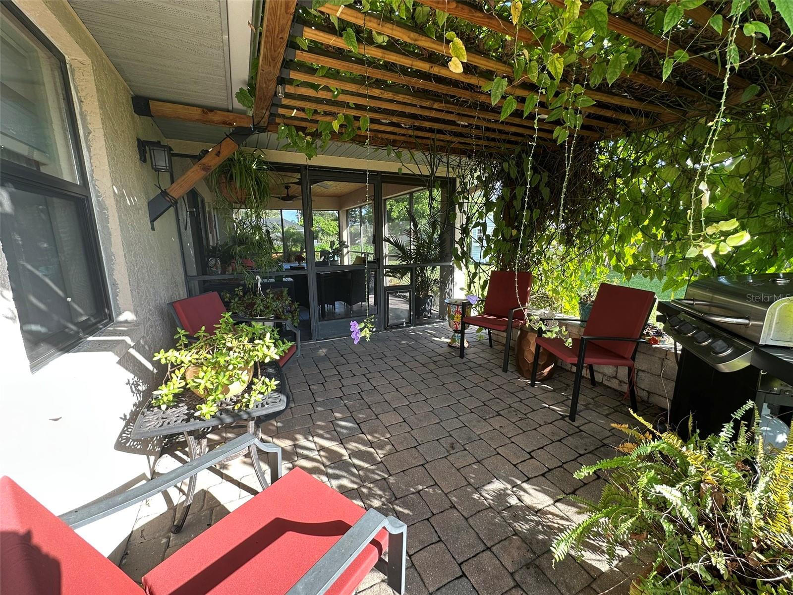 Pergola with lanai beyond.
