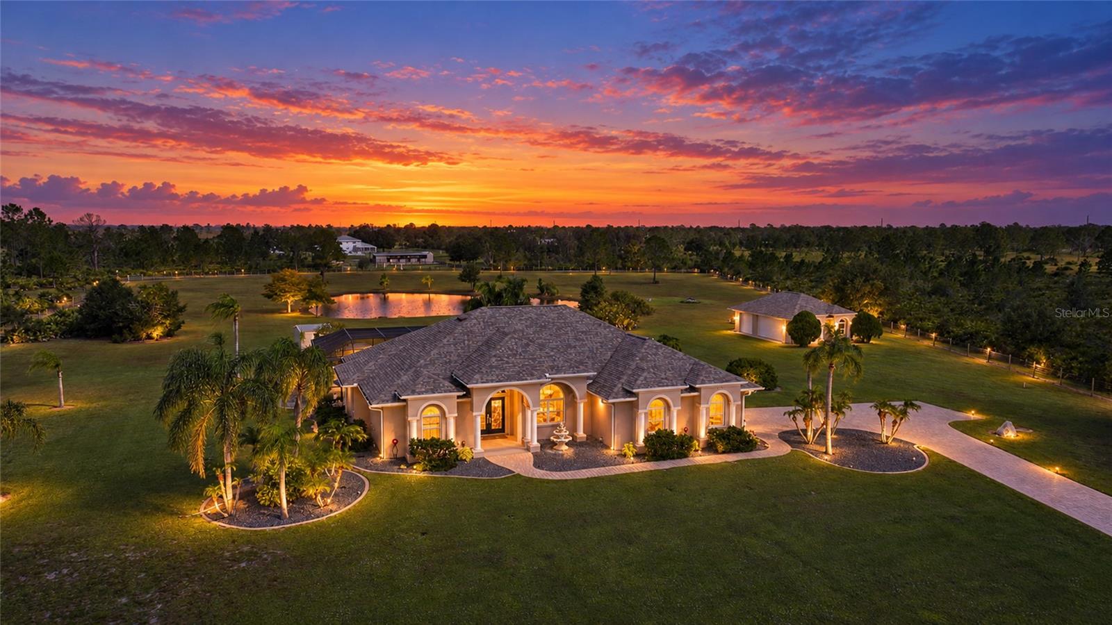 Photographer enhanced lighting - Property is Gorgeous! Secured, Gated Entry with Long, Paver Drive. 5 Car Garage, Pond, Fenced, 6.39 Acres, Shed with Electric and Patio, Equestrian Trails Photographer enhanced lighting - Property is Gorgeous! Secured, Gated Entry with Long, Paver Drive. 5 Car Garage, Pond, Fenced, 6.39 Acres, Shed with Electric and Patio, Equestrian Trails