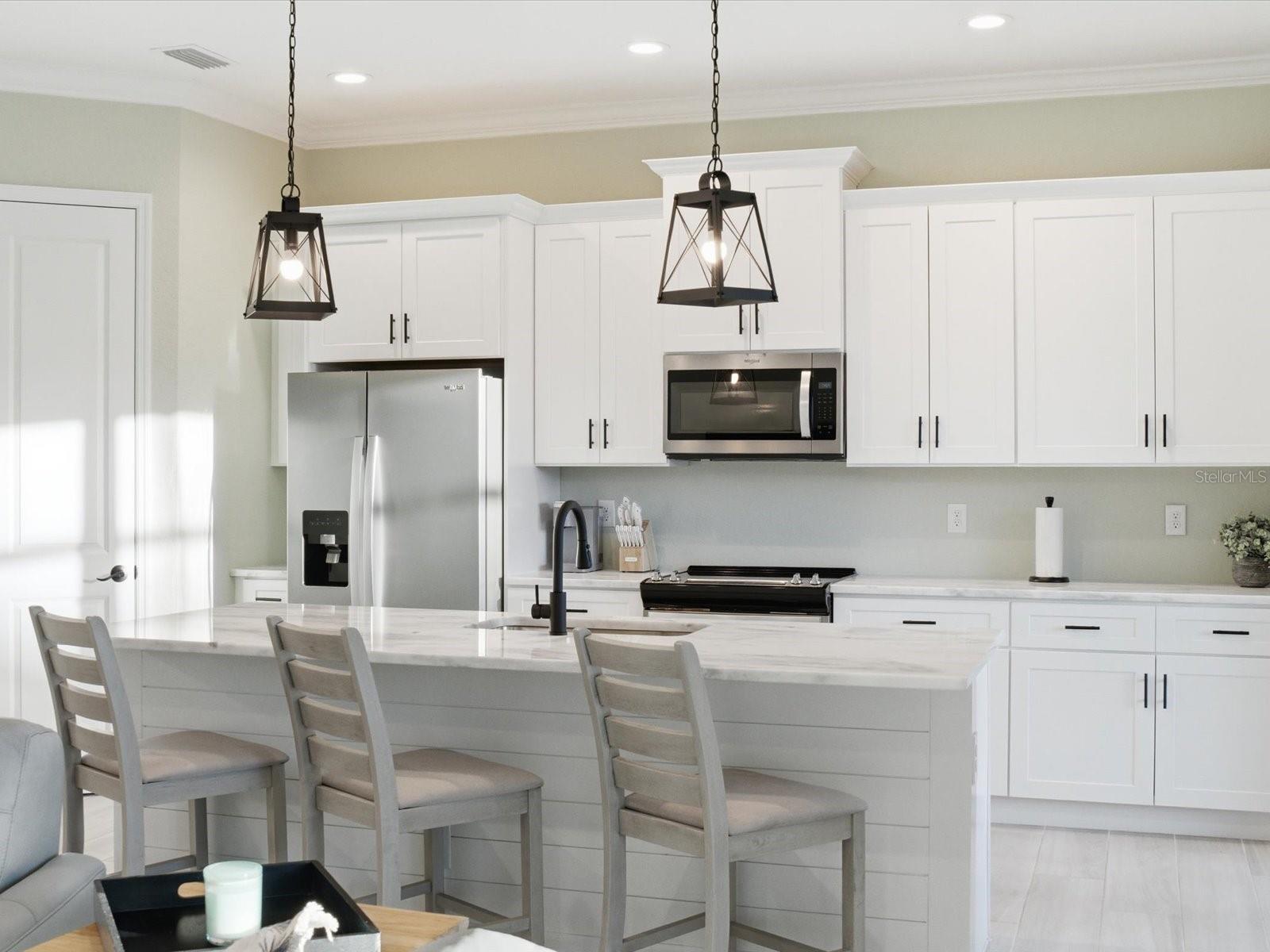 Kitchen island is accented with shiplap