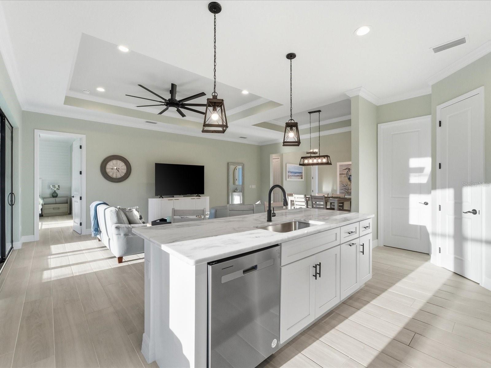 The gorgeous granite topped working island overlooks the Living Room for fantastic entertainment space