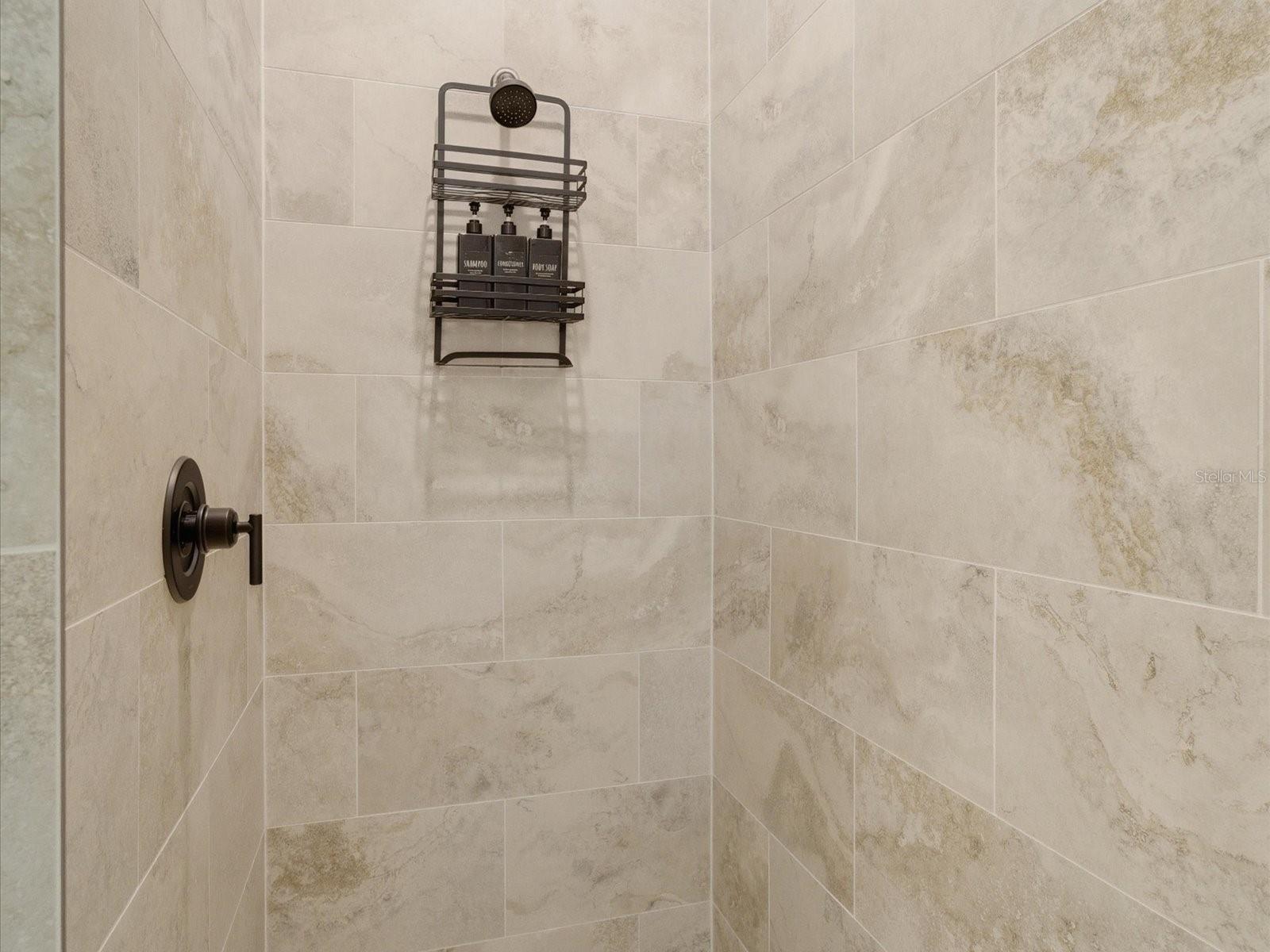 Primary's fully tiled shower