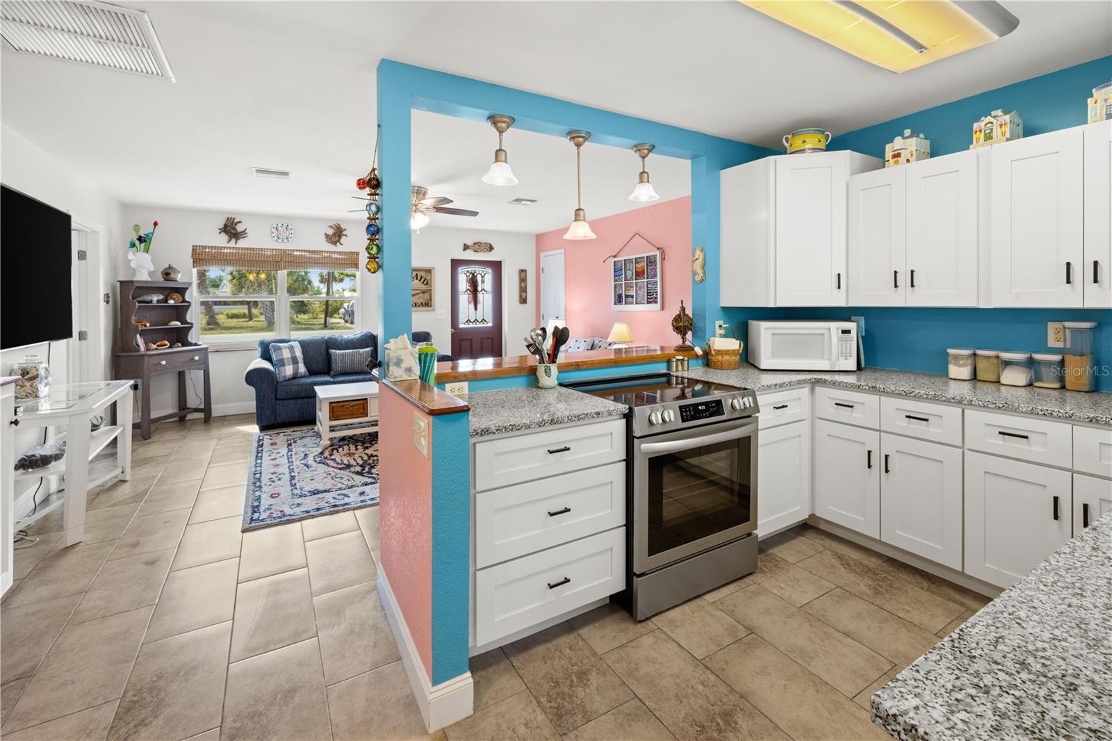 It's a "cook's kitchen".  Well designed and organized with stone counters and updated cabinetry.