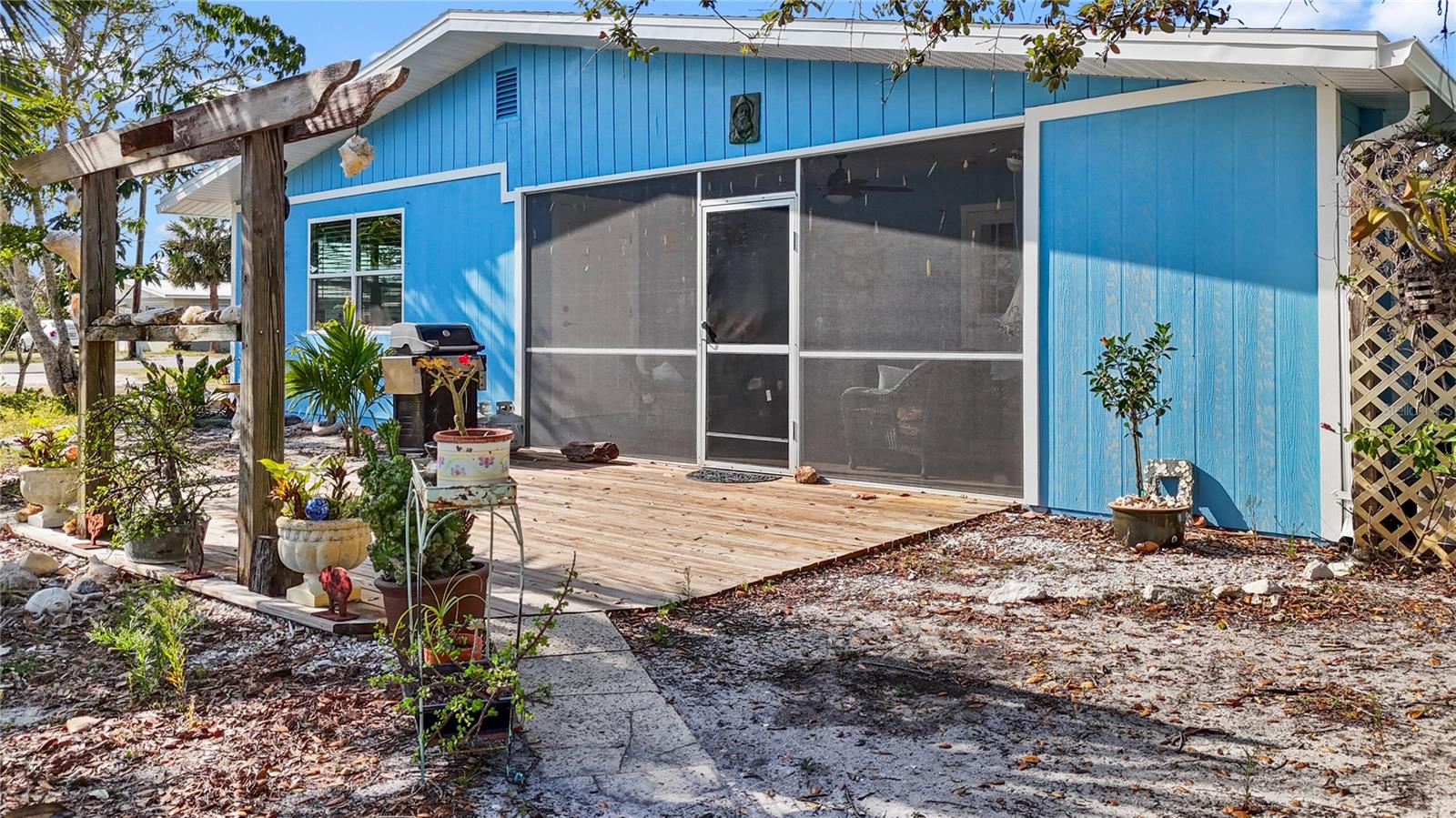 Outside of the screened lanai is a wooden deck area, which is a great place to sit on spring evenings!