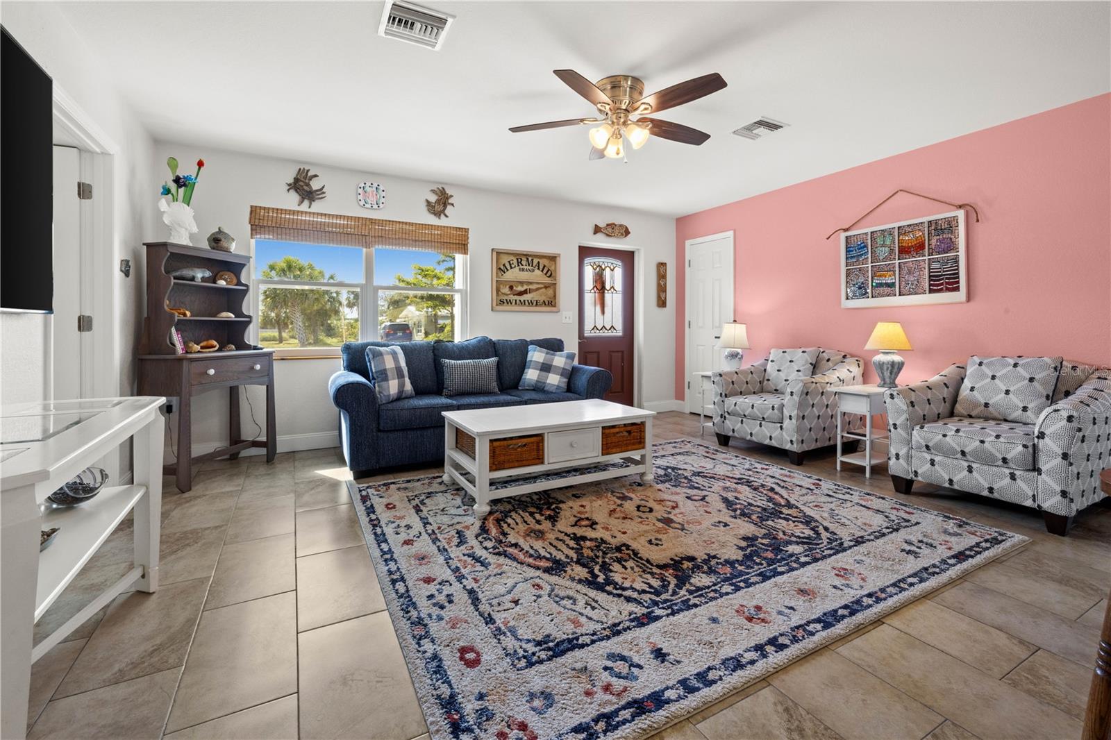 Throughout the home are well maintained ceramic tile.  The living room is bright and spacious.
