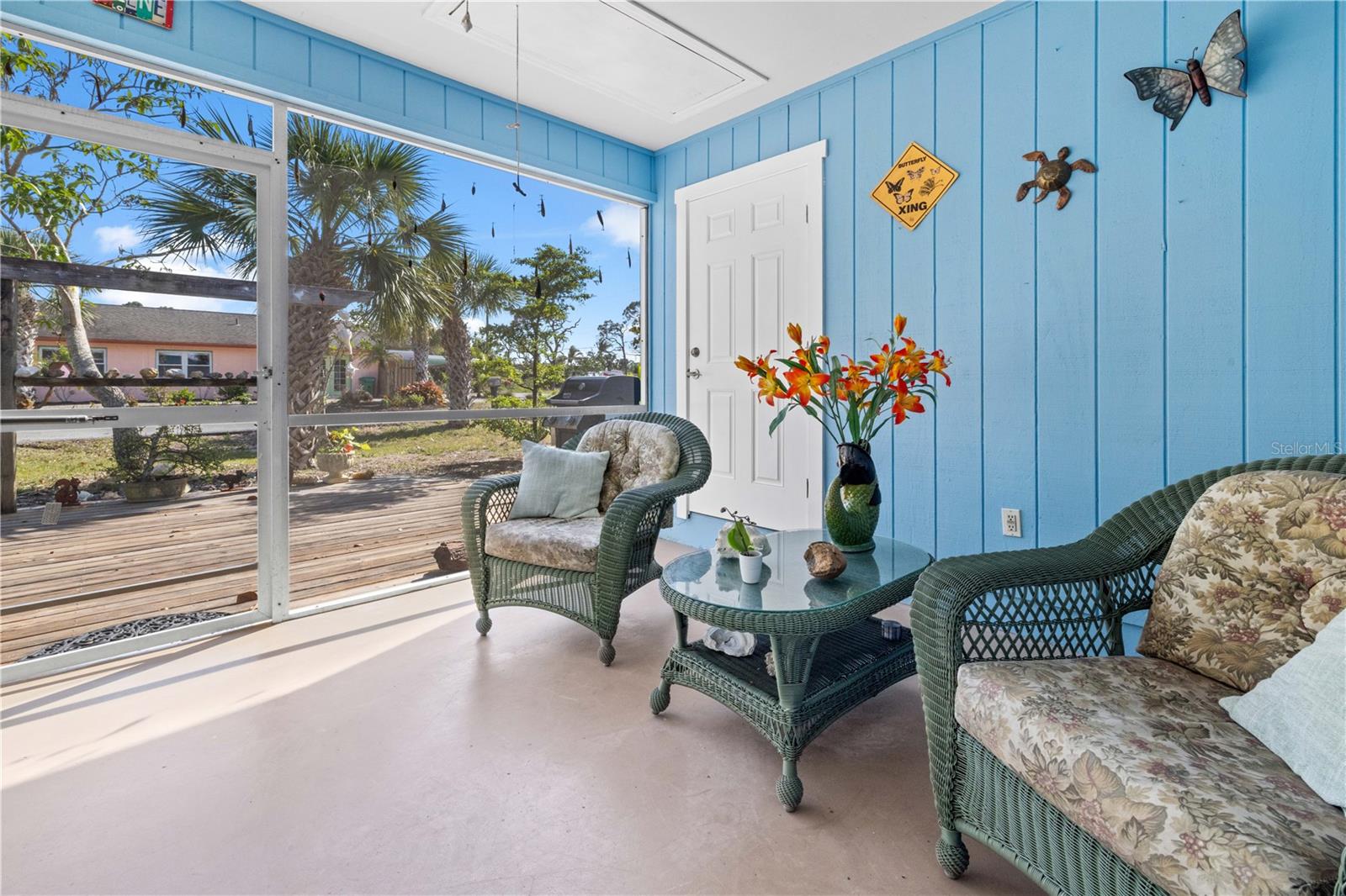 There are two ways to get to the outside lanai - from the third bedroom/family room or from the kitchen/dining room.  It's screened.