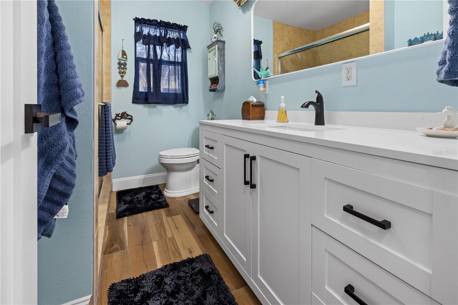 The bathroom has been updated. It has a shower.