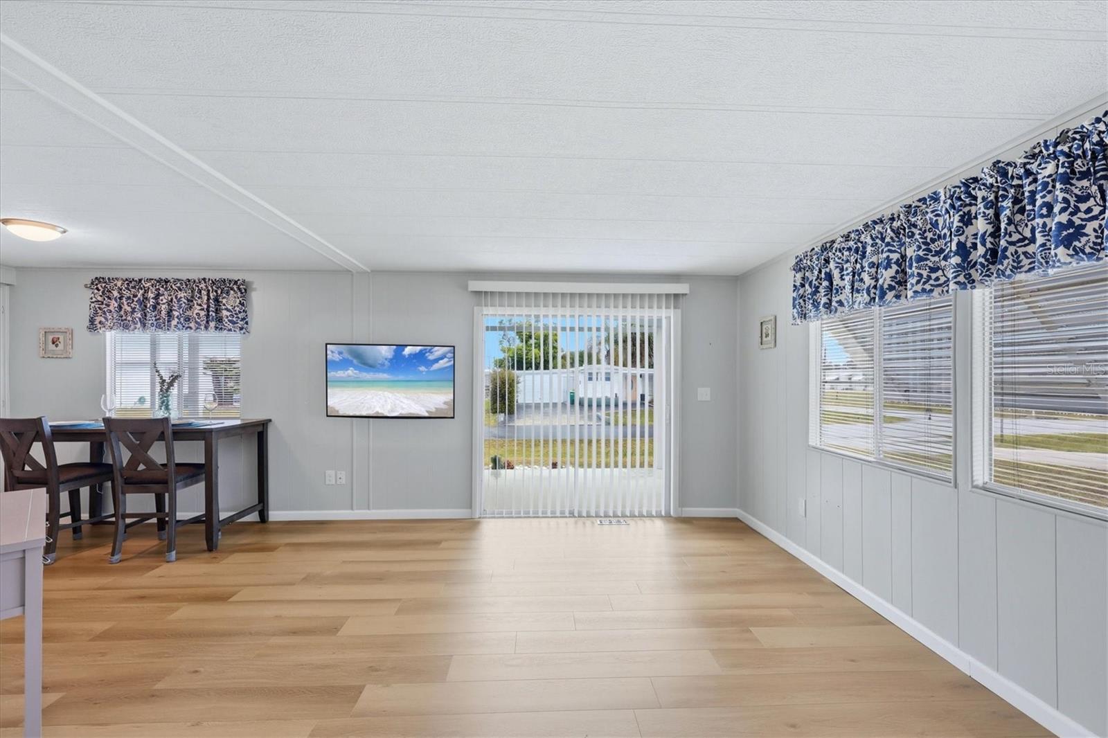Living room with sliders leading to front porch