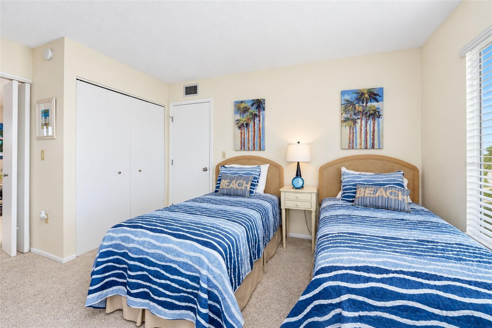 The guest bedroom features a wall closet.