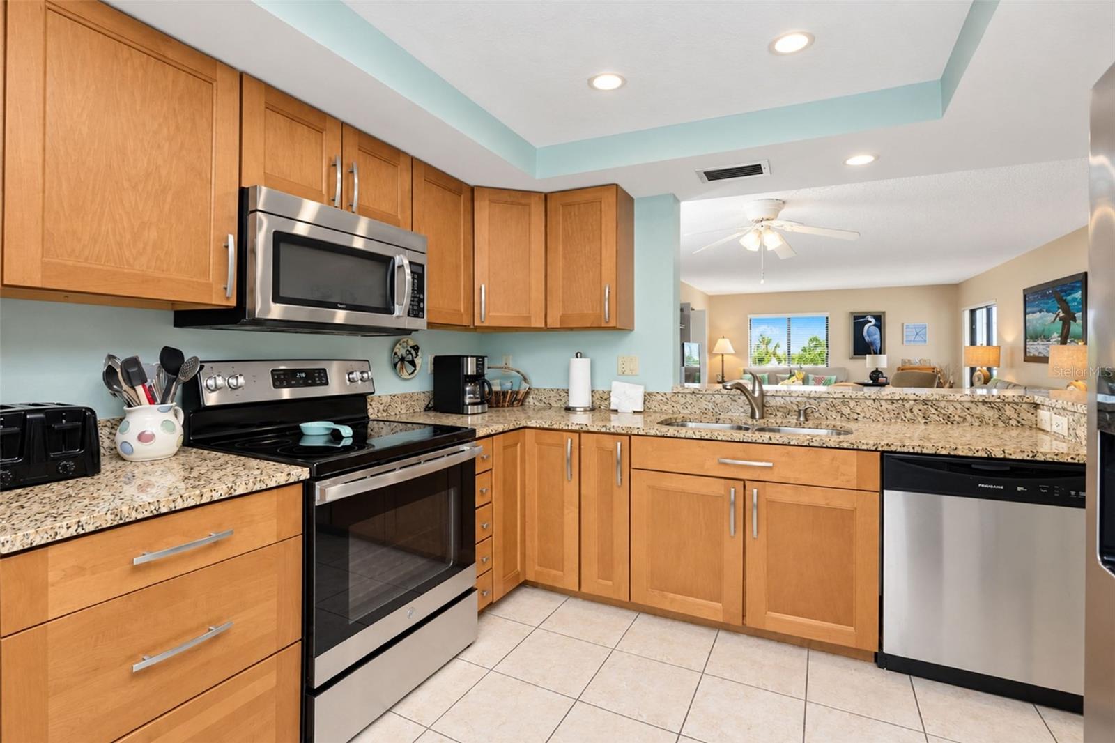 The maple cabinetry and granite countertop is very pretty!