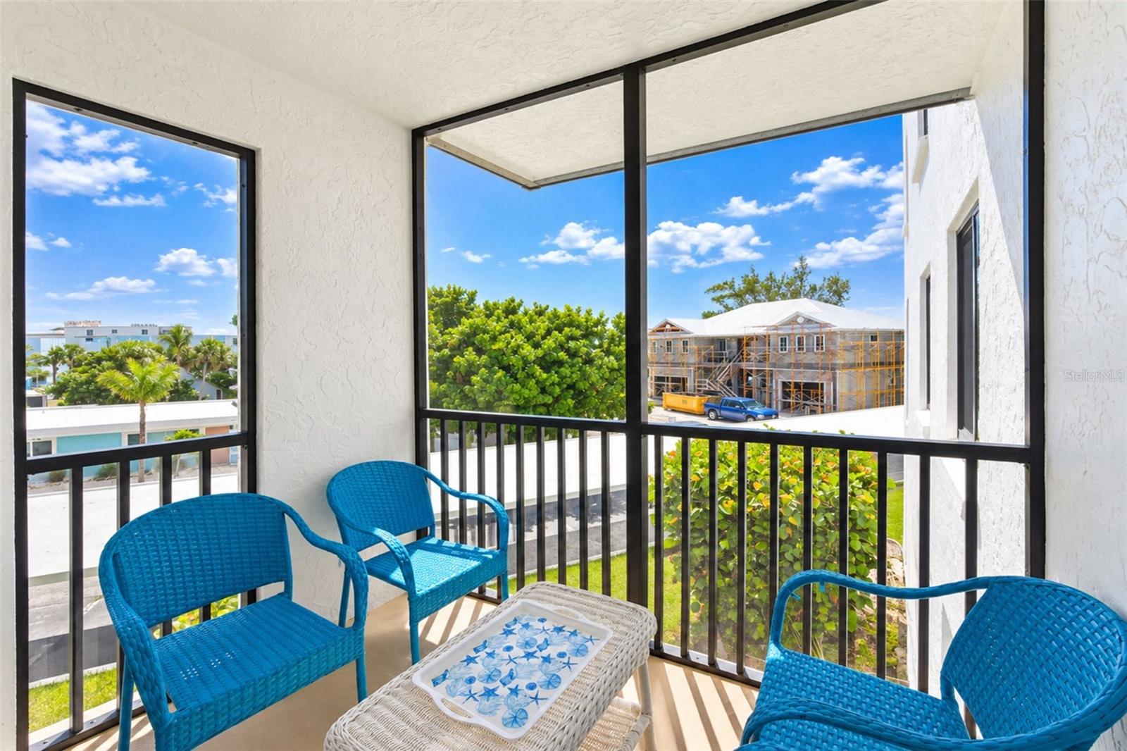 The screened lanai is a nice spot for morning coffee.