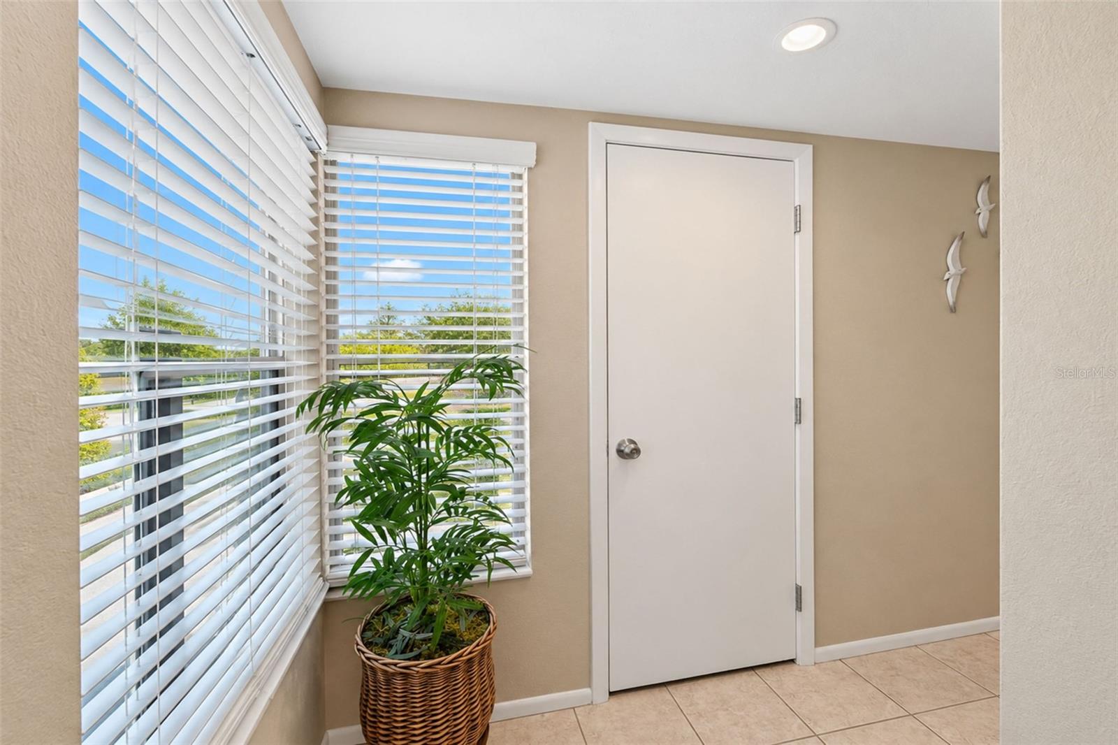 The front entry has tiled flooring and natural light. The front entry has tiled flooring and natural light.