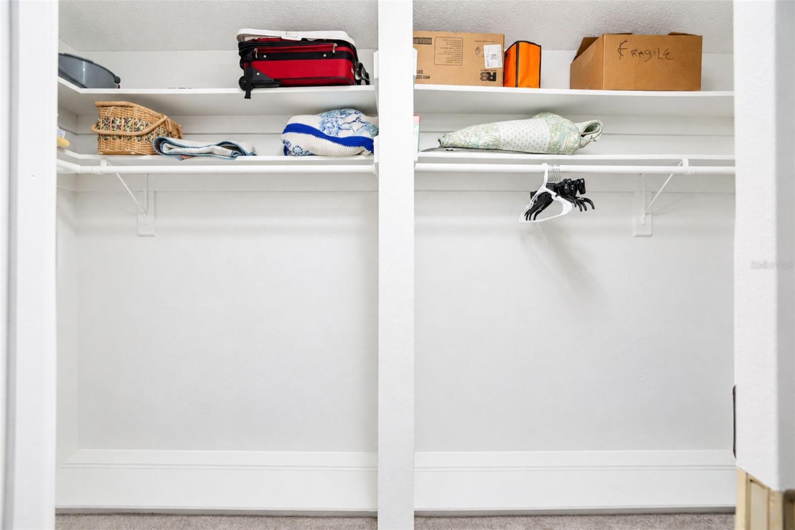 Primary bedroom walk-in closet