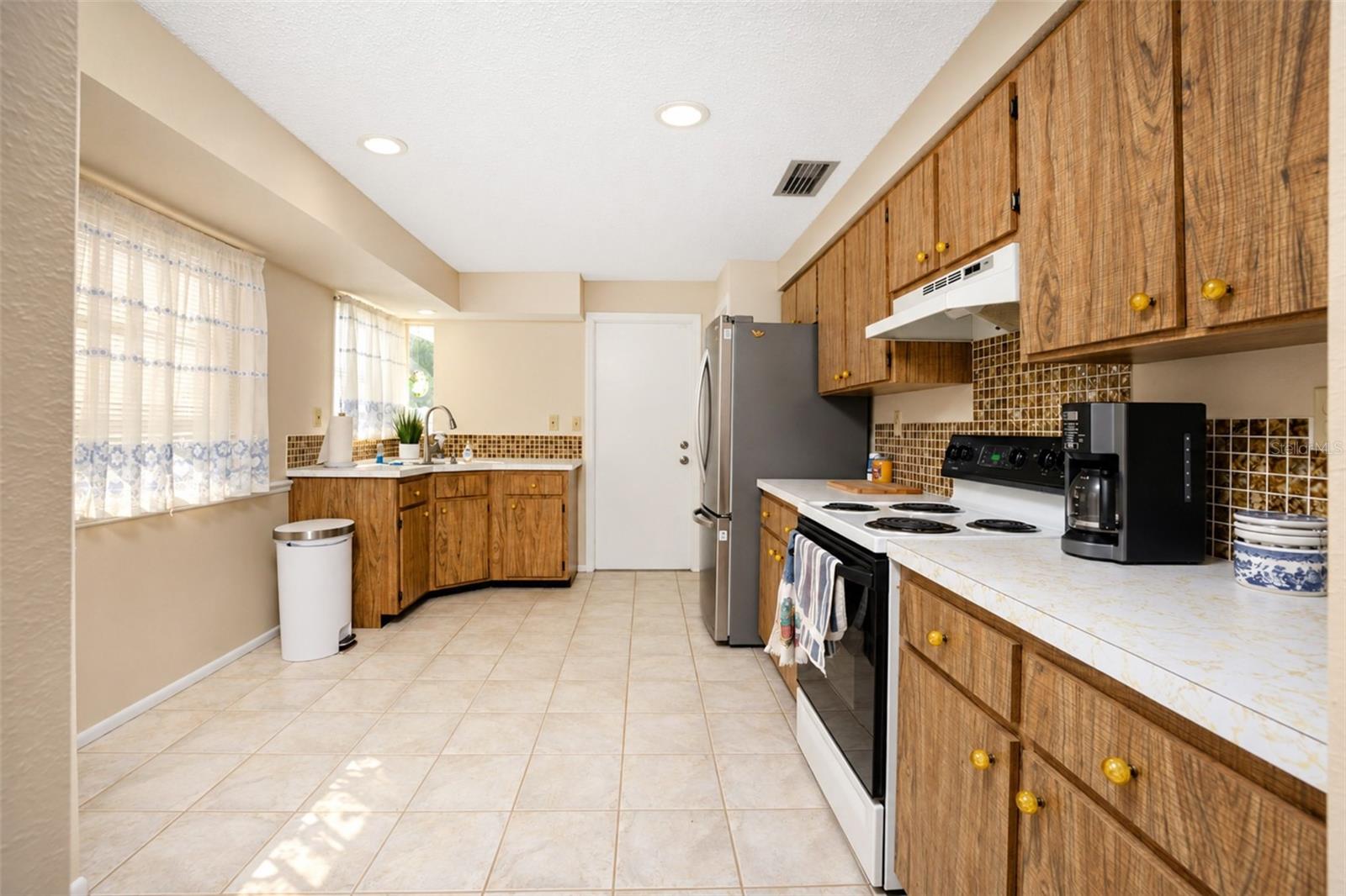 Spacious kitchen accessed through dining room