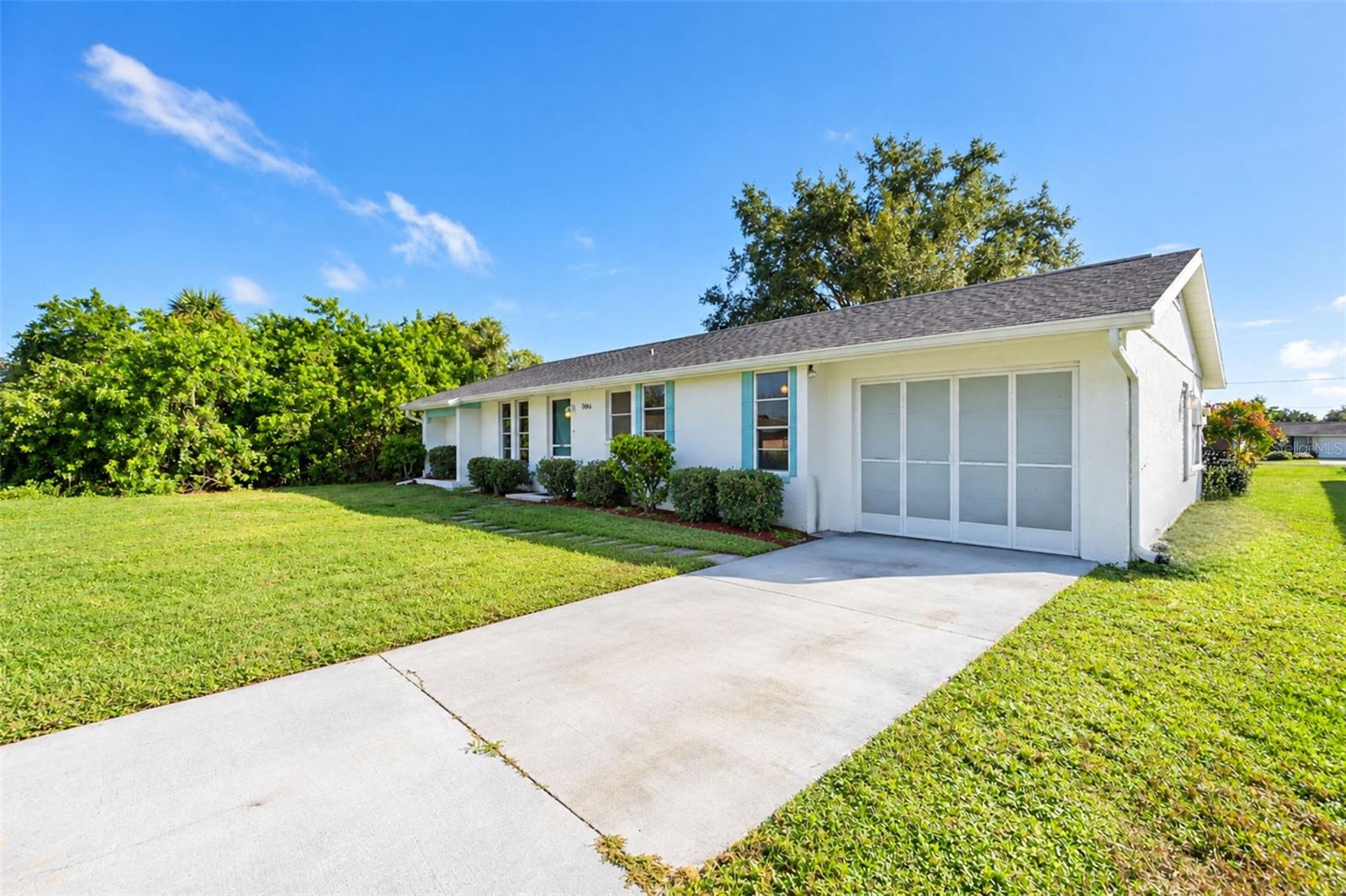Front view with screened garage