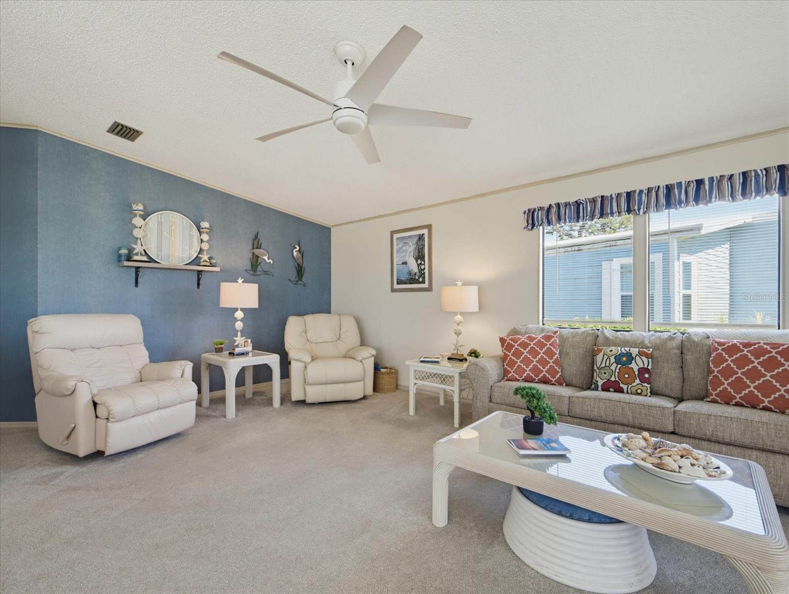 LIVING ROOM HAS CARPET AND UPDATED FAN. LIVING ROOM HAS CARPET AND UPDATED FAN.