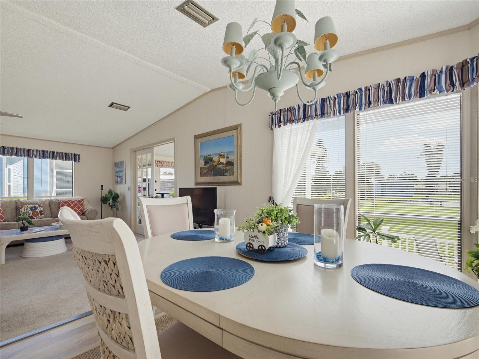THE DINING ROOM FEATURES A RELAXING WATER VIEW.
