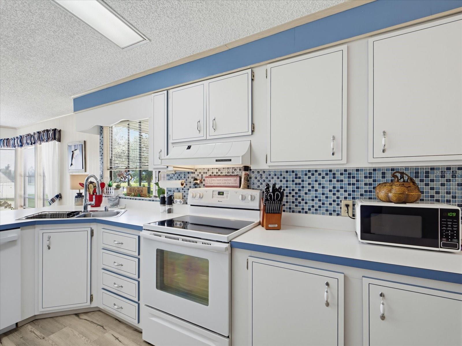 KITCHEN FEATURES A COASTAL BACKSPLASH. KITCHEN FEATURES A COASTAL BACKSPLASH.