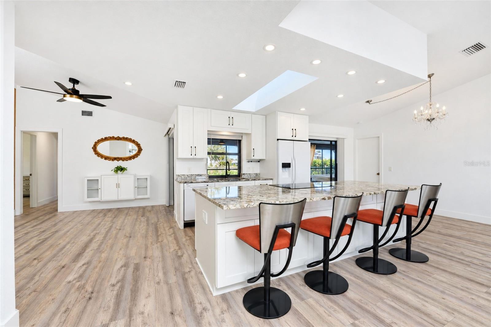 Oversized granite island with breakfast bar seating Oversized granite island with breakfast bar seating