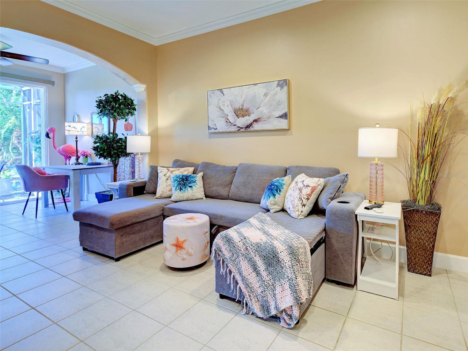 Living Room with extension and attached screened lanai with preserve view.