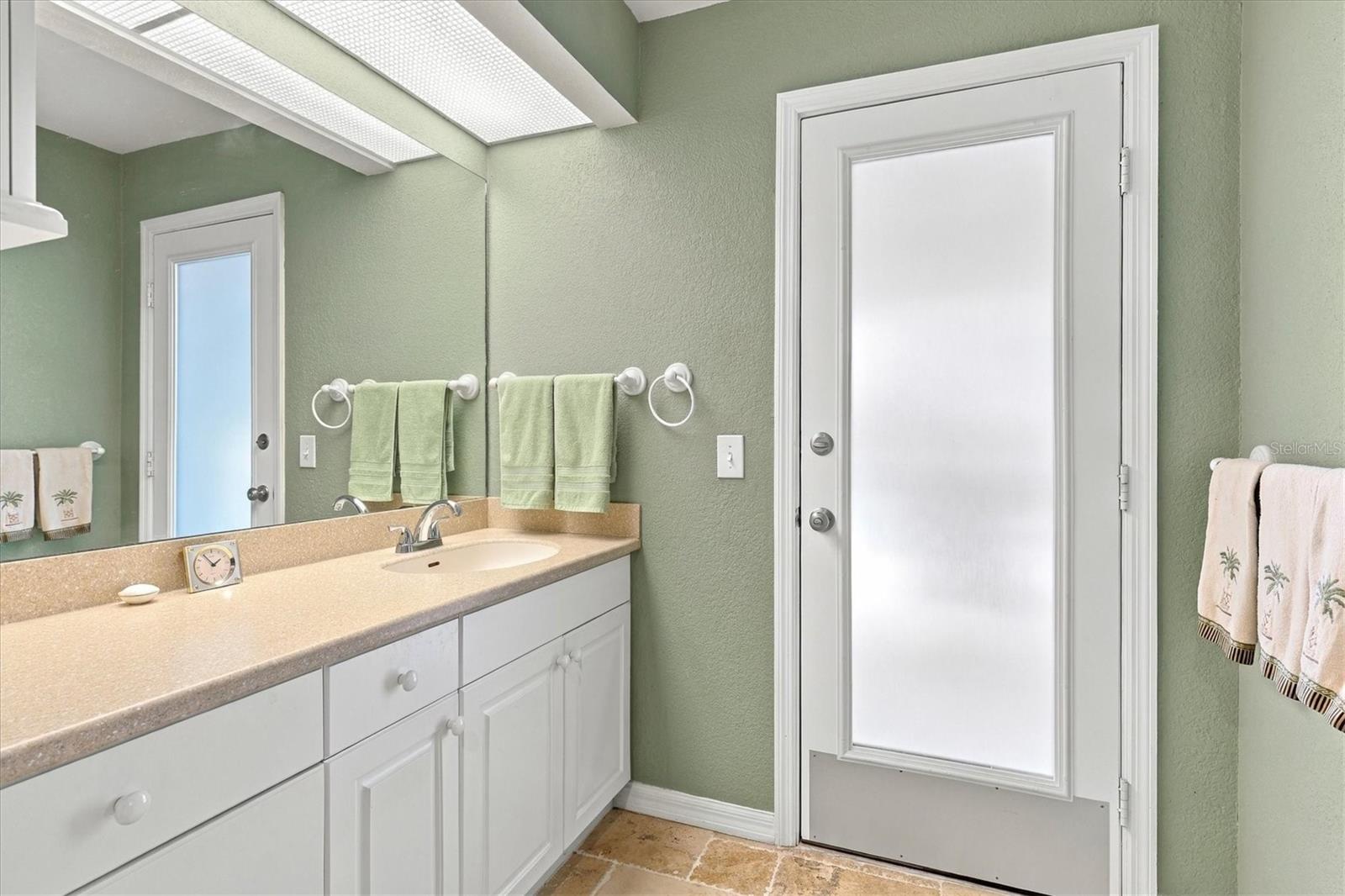 Primary Corian counter; lanai access/pool bath