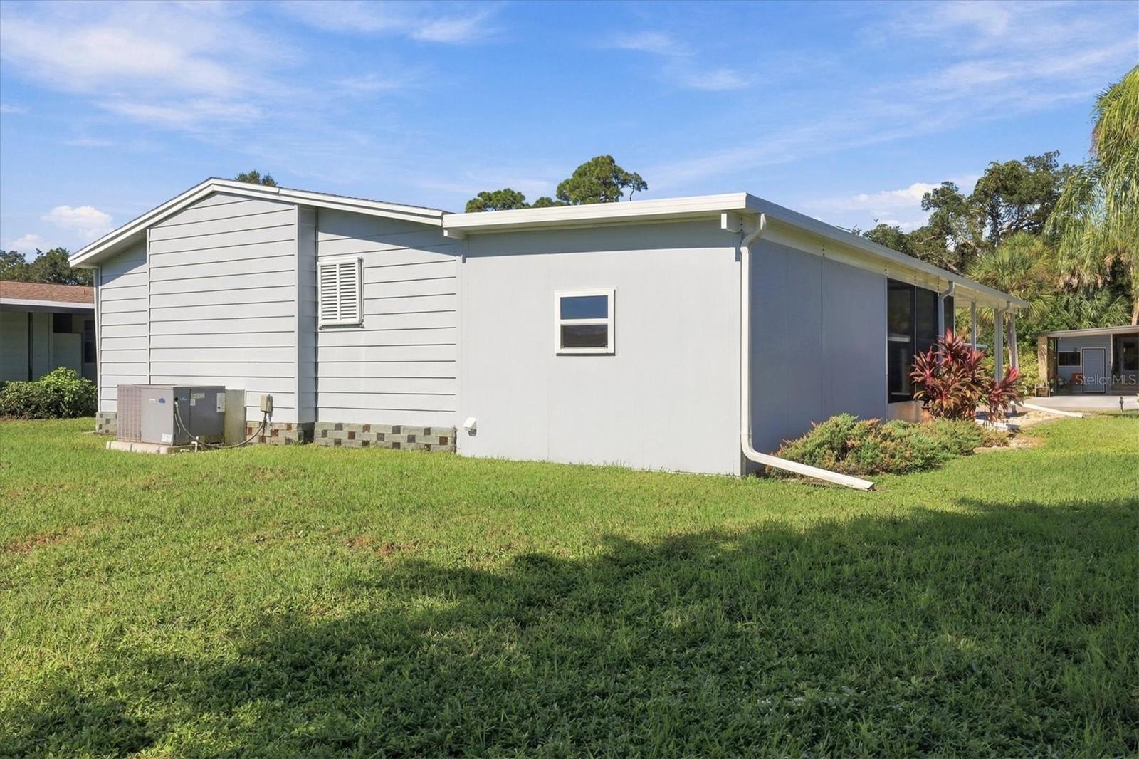 Newer shed off carport