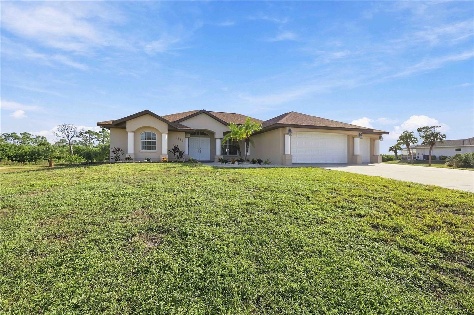 Front exterior and spacious front yard