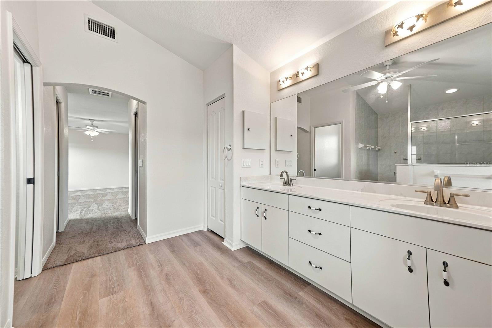 Primary bathroom vanity and mirror