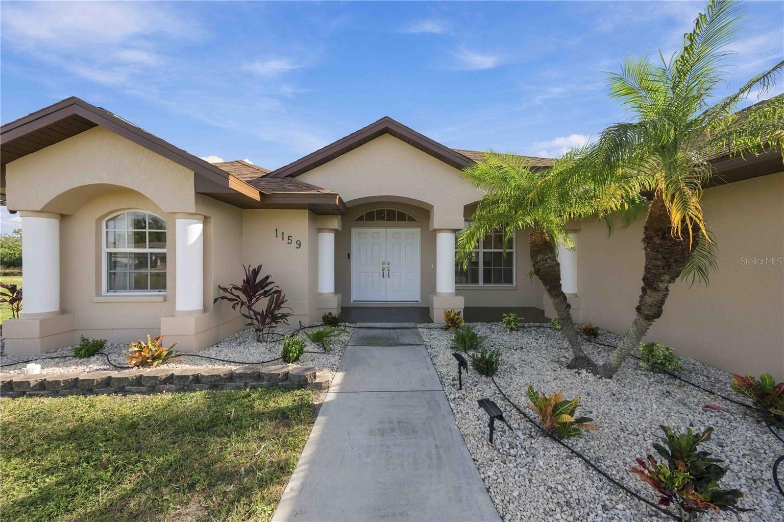 Covered front entry with landscaped walkway