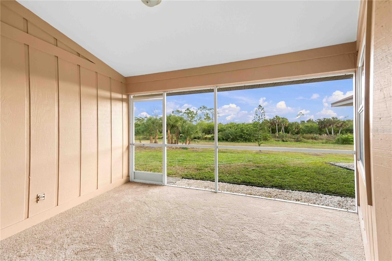 Screened lanai overlooking the backyard
