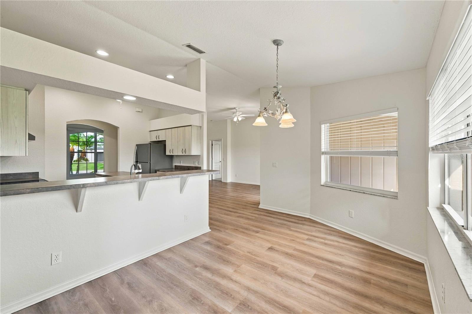 Kitchen with breakfast bar and dining nook
