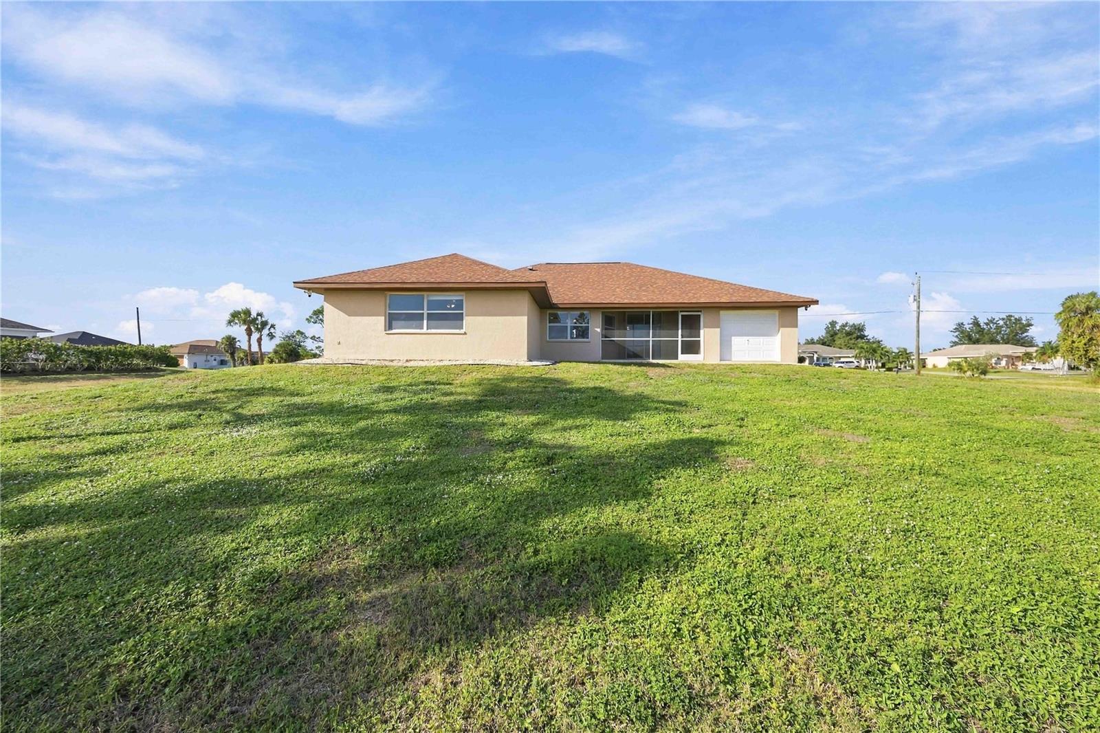 Rear exterior and expansive lot