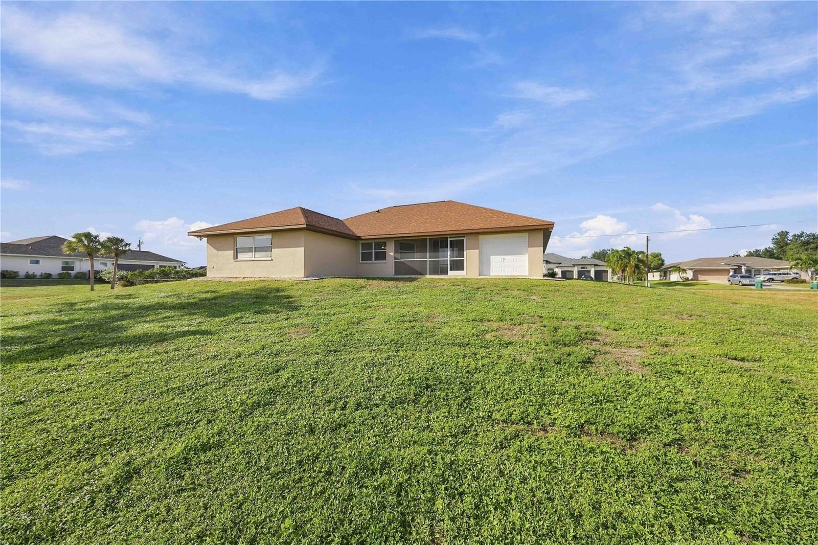 Rear exterior and large backyard