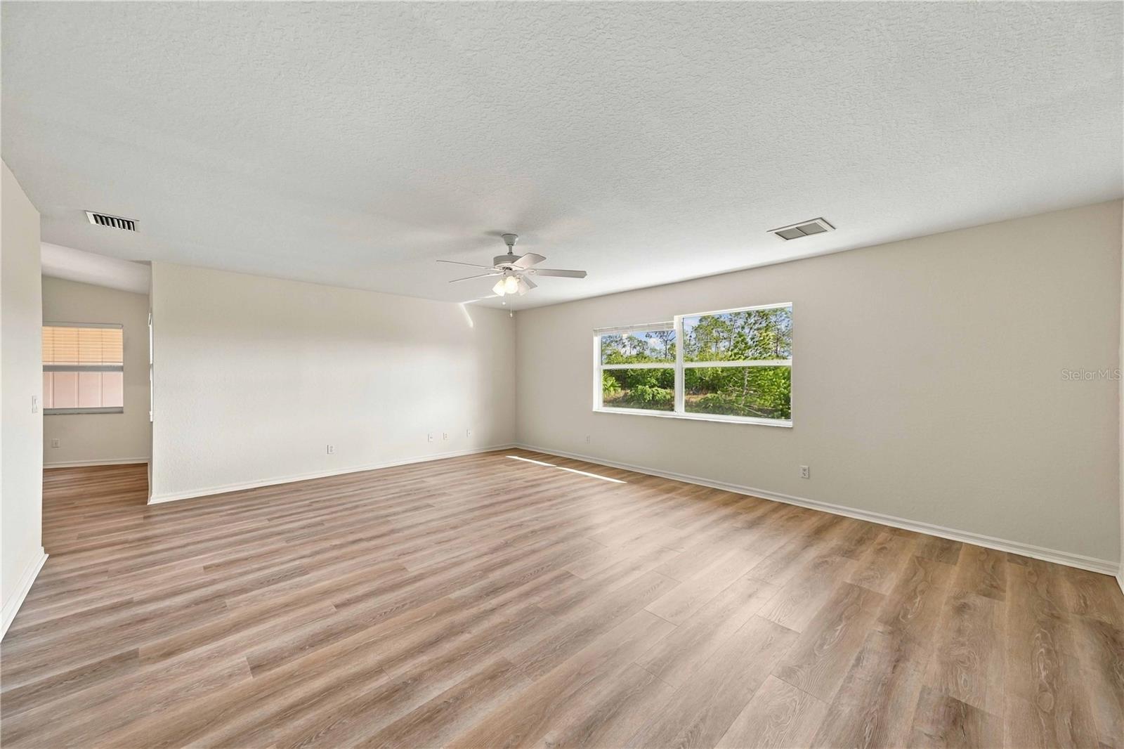 Spacious family room with ceiling fan