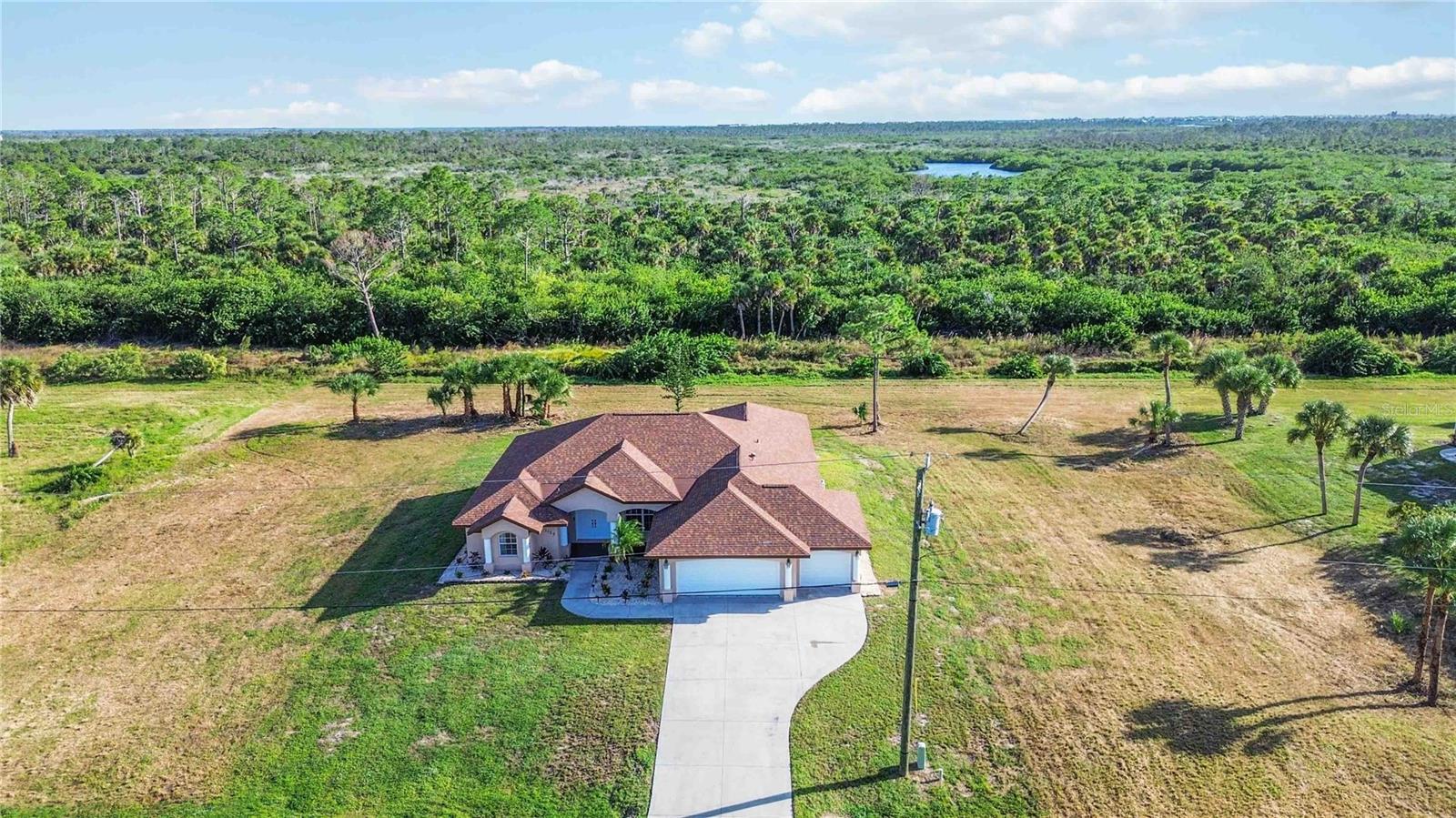 Aerial view of the home and surrounding area Aerial view of the home and surrounding area