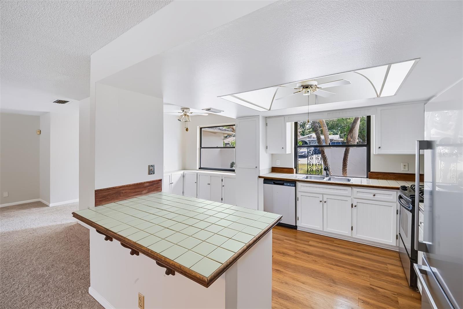 View from the dinette small breakfast bar area into the kitchen