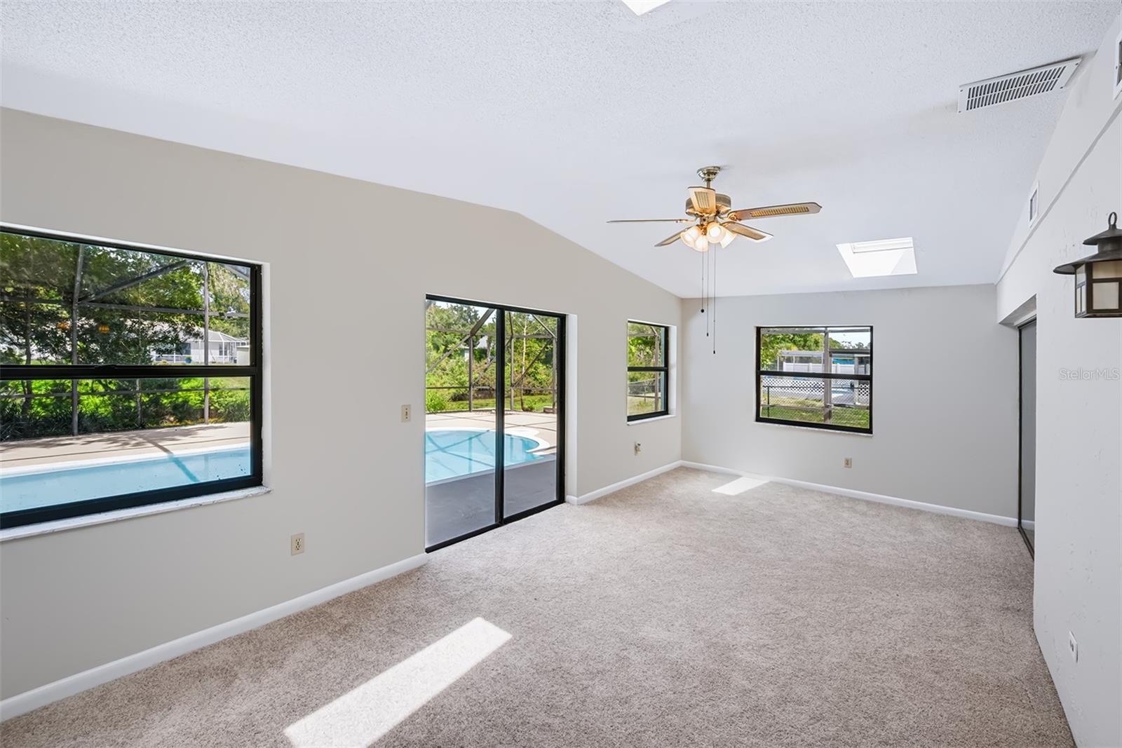 Large Florida room with 2 skylights and celing fan