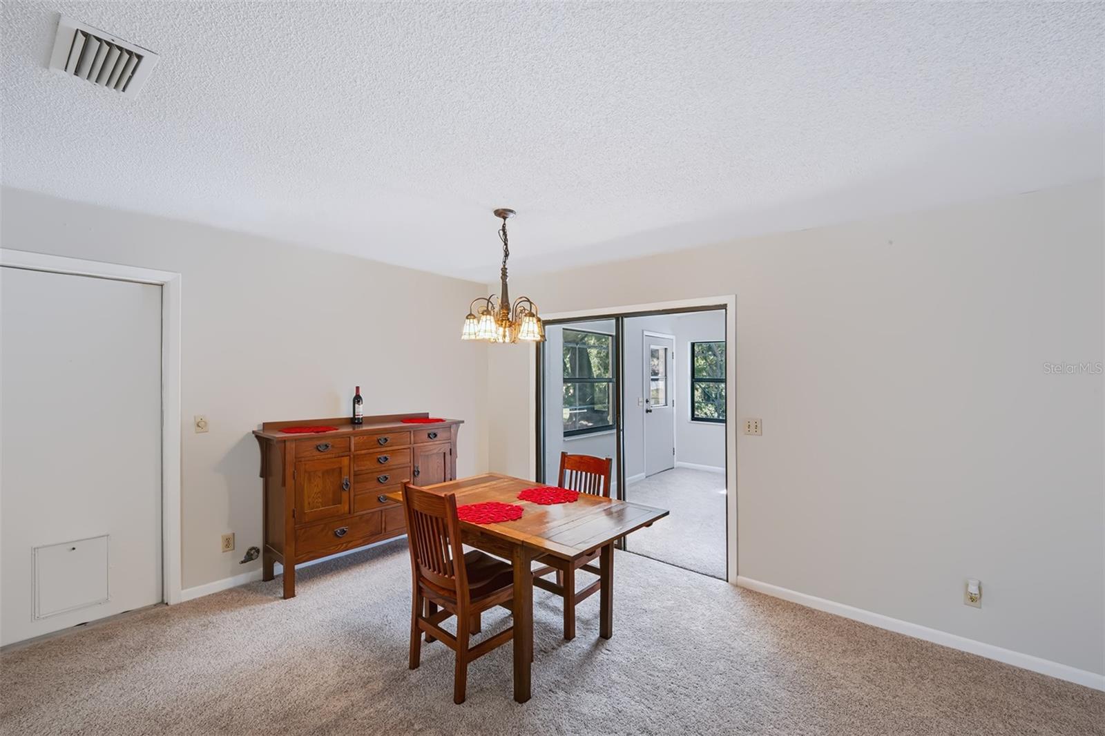 Sliding glass door entry into the Florida room from dinette