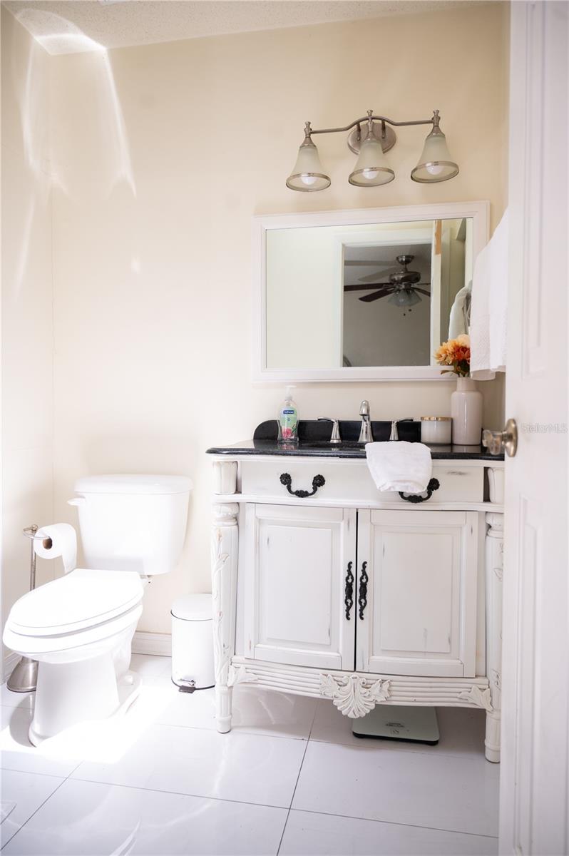Ensuite primary bathroom with custom cabinetry and premium finishes.